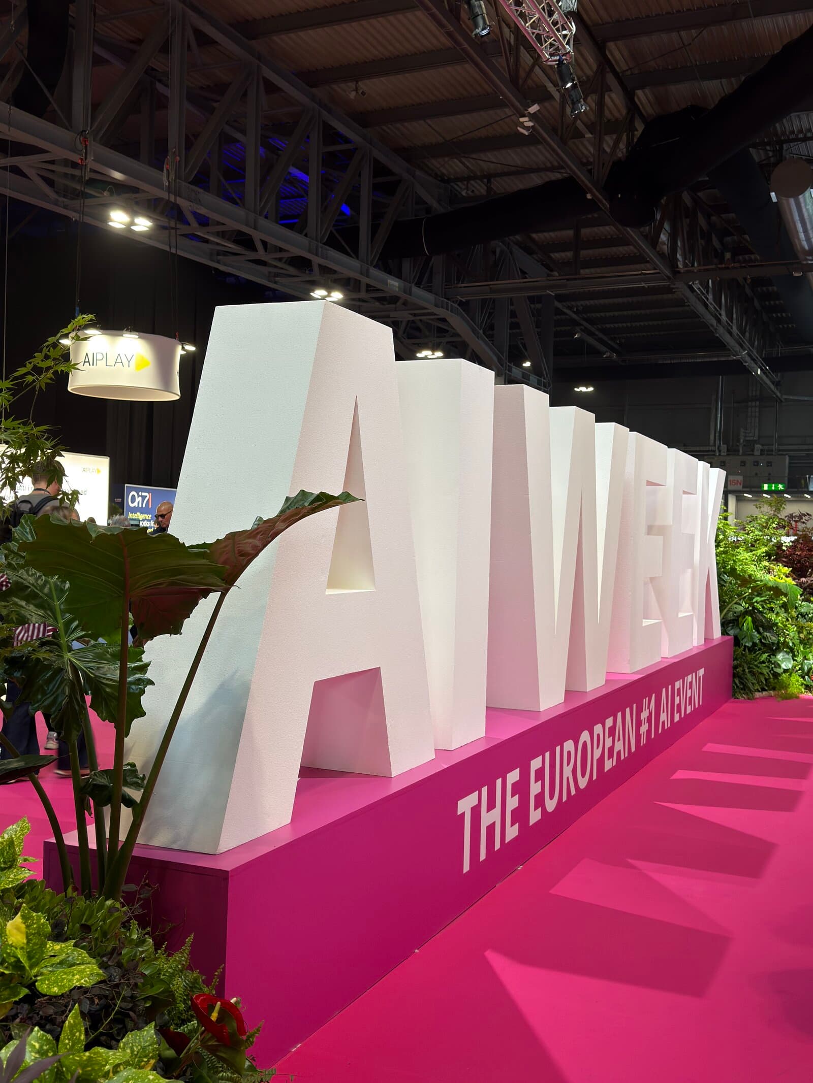 AI WEEK Milan — The European #1 AI Event, giant pink signage on the show floor